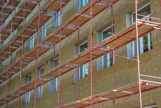 A front wall of a building is insulated in Hartford, CT.