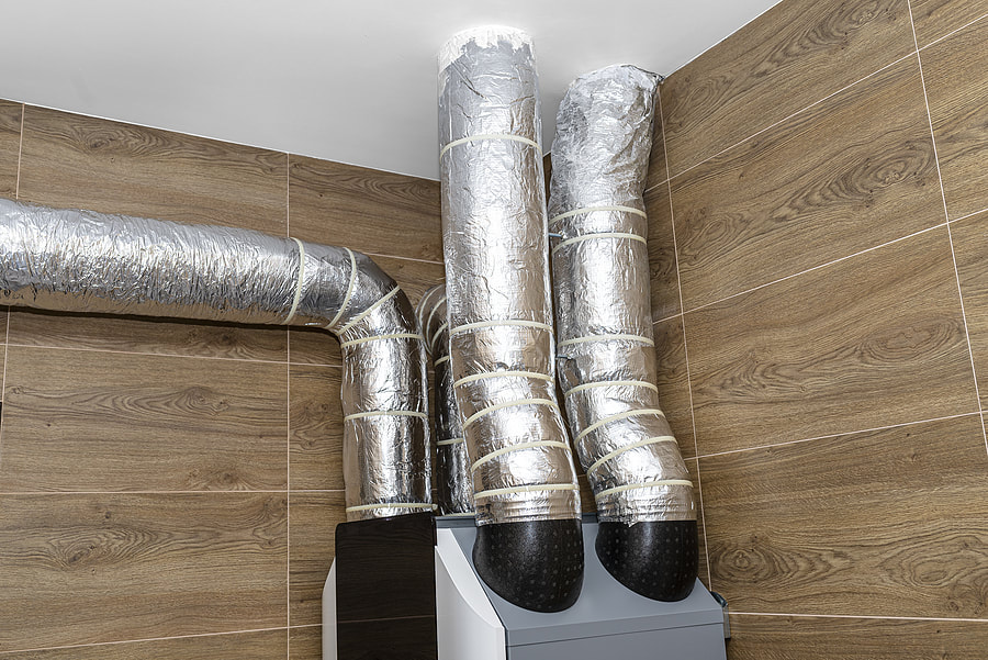 The pipes of the Hartford, CT home are insulated with silver foil.